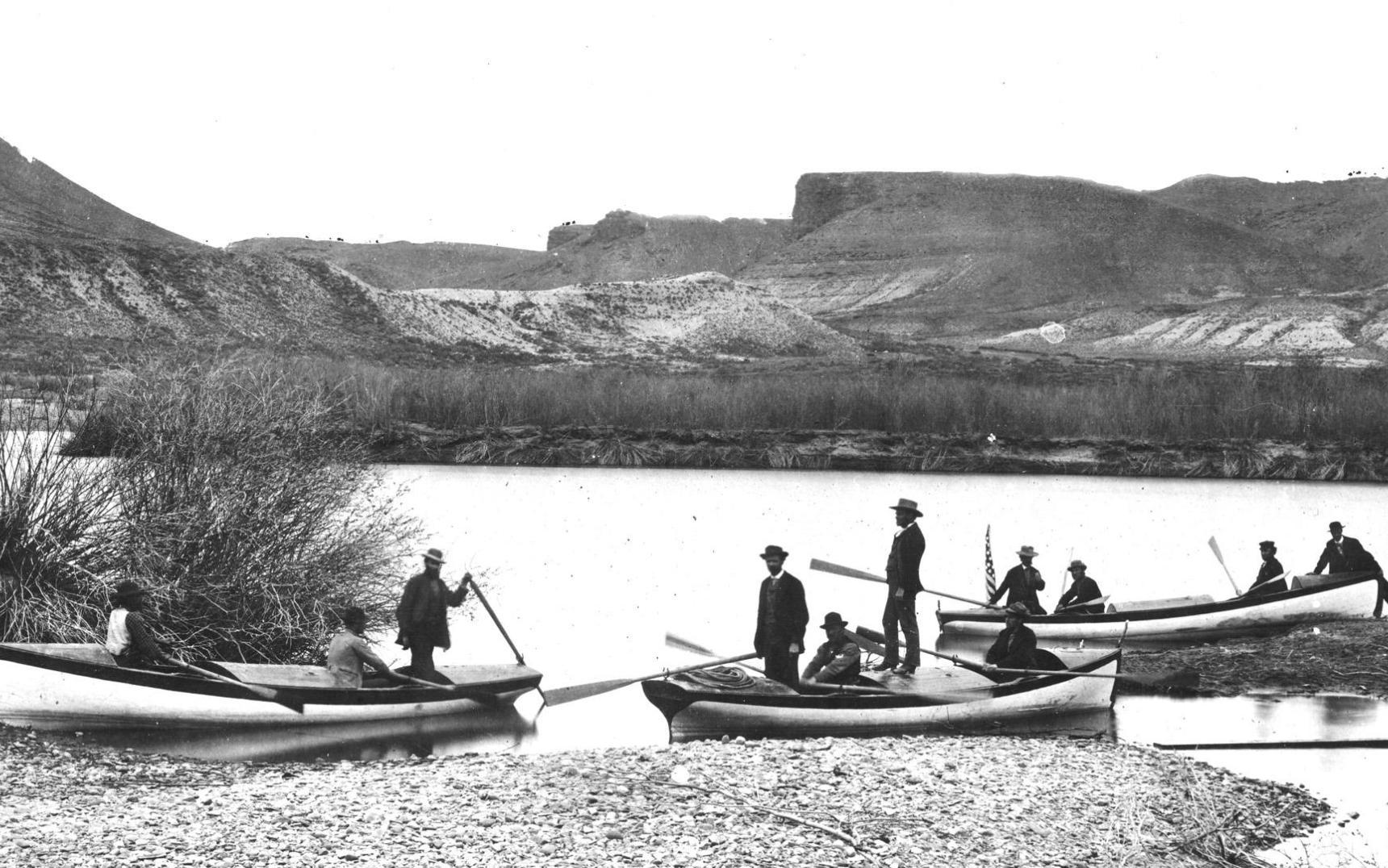 Photo of John Wesley Powell and friends on boats in a river