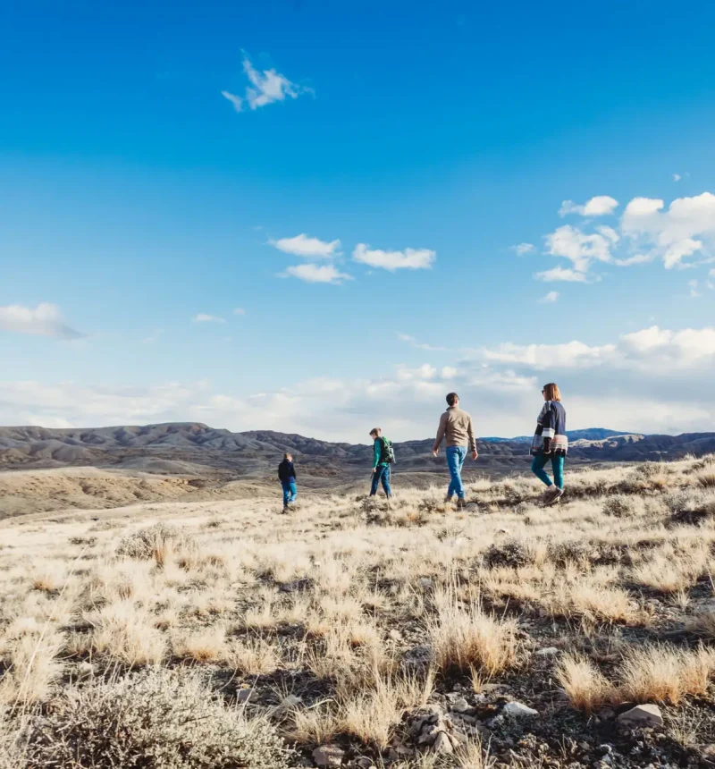 A family of four exploring McCullough Peaks near Powell, Wyoming