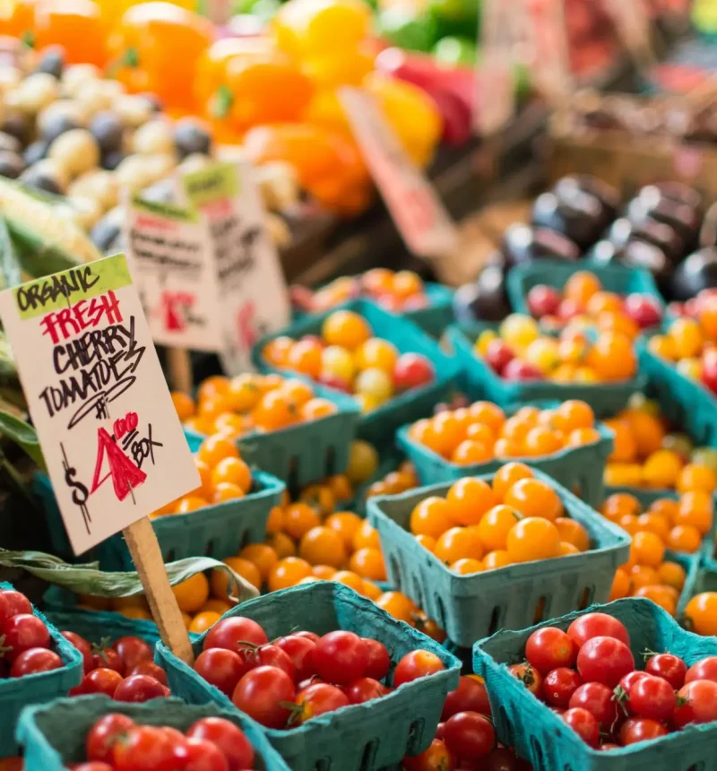 Farmer's Market featuring fresh produce like cherry tomatoes, corn, and bell peppers